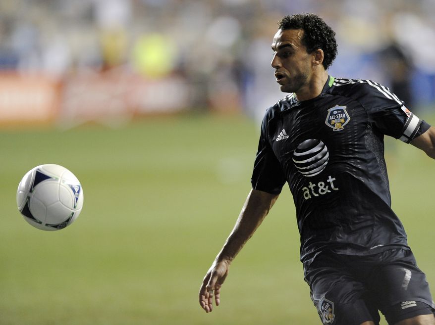 ** FILE ** MLS All-Stars' Dwayne De Rosario of D.C. United recieves a pass during the MLS All-Star game against Chelsea FC on Wednesday, July 25, 2012, in Chester, Pa. The MLS All Stars won 3-2. (AP Photo/Michael Perez)