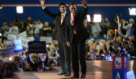 Republican presidential nominee Mitt Romney is joined on stage by his running mate, vice-presidential nominee Rep. Paul Ryan, after Romney accepted the nomination of the Republican Party for President of the United States at the Republican National Convention at the Tampa Bay Times Forum in Tampa, Fla. on Thursday, August 30, 2012.  (Andrew Harnik/ The Washington Times)