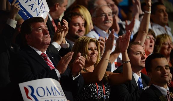 Republicans celebrate after Mitt Romney accepts the nomination of the Republican Party for President of the United States at the Republican National Convention at the Tampa Bay Times Forum in Tampa, Fla. on Thursday, August 30, 2012.(Andrew Harnik/ The Washington Times)