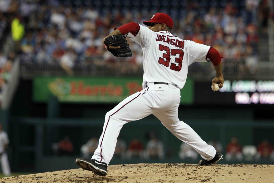 Washington Nationals starting pitcher Edwin Jackson (33) throws during a baseball game with the St. Louis Cardinals at Nationals Park, Thursday, Aug. 30, 2012, in Washington. The Nationals won 8-1. (AP Photo/Alex Brandon)