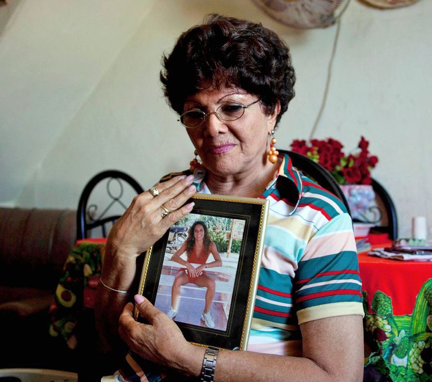 Emelia Moreno, 75, lives alone after her only child left for the U.S. a decade ago. (Associated Press)