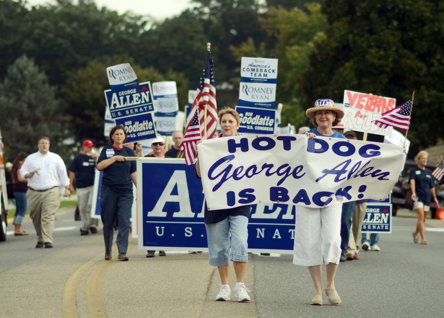 Republican volunteers march in support of George Allen during the Labor Day parade on Monday in Buena Vista, Va., a small town on the western slopes of the Blue Ridge Mountains. The parade was the first big political event of the season in the Shenandoah Valley and featured both candidates for Senate. (Associated Press)
