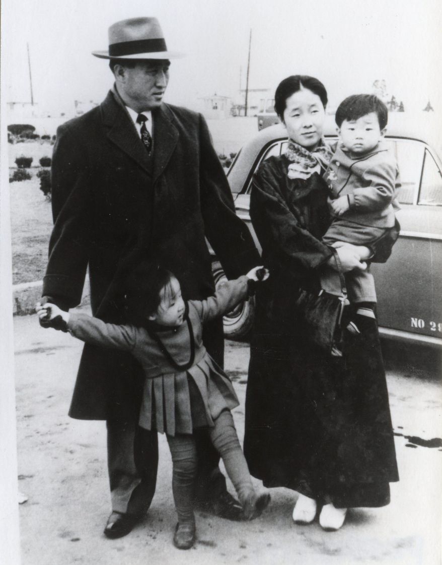 The Rev. Sun Myung Moon with his wife, Hak Ja Han Moon, whom he married in 1960 when she was 17, pose with son Hyo Jin and daughter Ye Jin in mid-1960s. (HSA-UWC photographs)