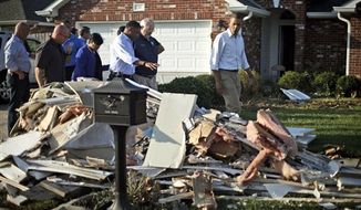 President Obama walks past debris on the sidewalks as he tours the Bridgewood neighborhood in LaPlace, La., in the Saint John the Baptist Parish, with local officials to survey the ongoing response and recovery efforts to Hurricane Isaac, Monday, Sept. 3, 2012. (AP Photo/Pablo Martinez Monsivais)