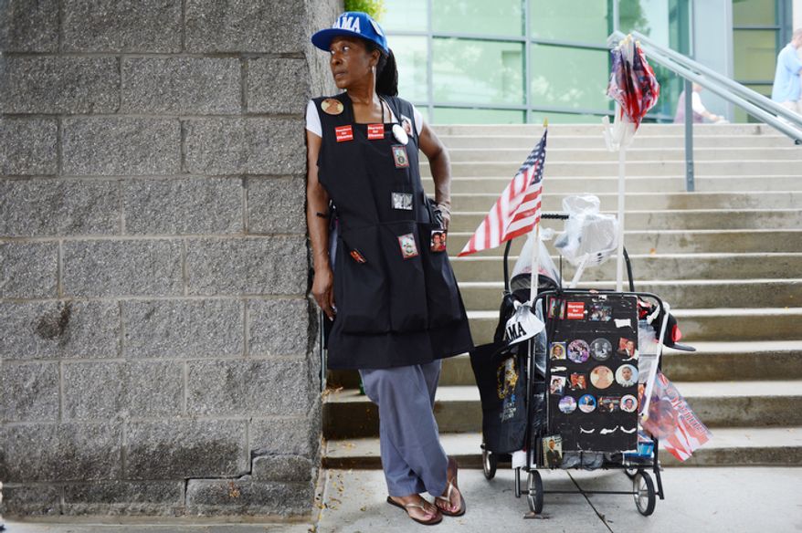 Claudia Blakemore, a registered nurse from Houston, Tex., drove to Charlotte, N.C. to sell Obama commemorative items during the convention. She said she bought a lot of the items for the last Democratic convention and is able to sell things relatively cheaply because she bought in bulk--some 10,000 buttons, for example. (Barbara L. Salisbury/The Washington Times)