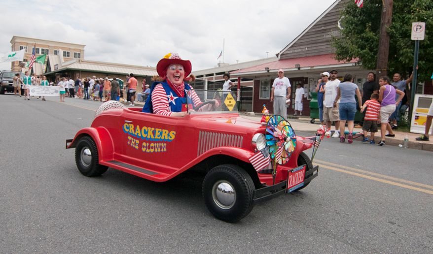 Crackers, The Clown, rides her tinny car in the Labor Day parade on Monday, Sept. 3, 2012, in Gaithersburg, Maryland. (Craig Bisacre/The Washington Times)