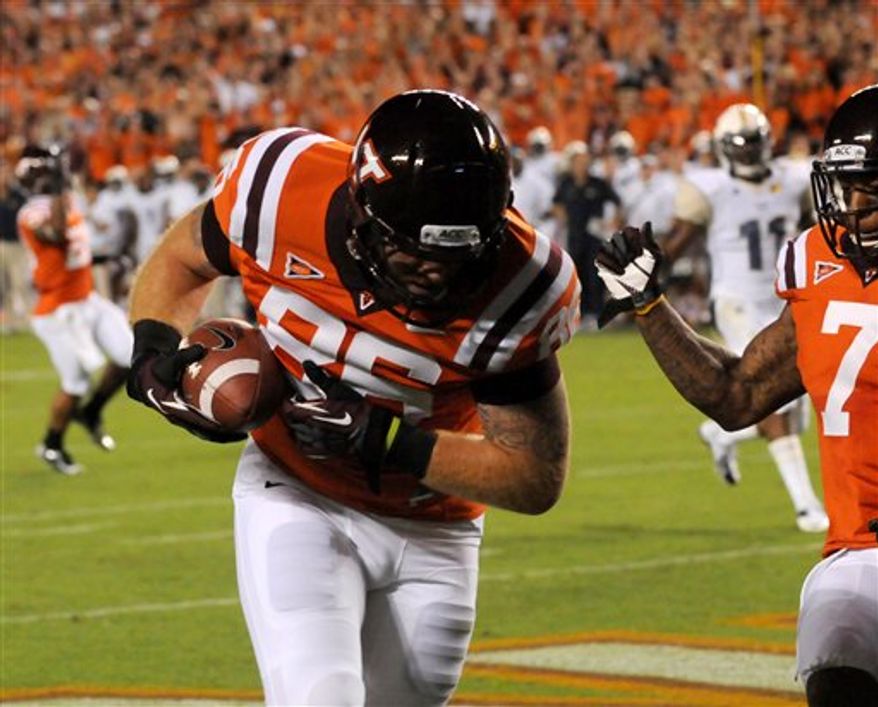 Virginia Tech's Eric Martin (86) hauls in a touchdown catch against Georgia Tech during the first half of a college football game, Monday, Sept. 3, 2012, in Blacksburg, Va. (AP Photo/Don Petersen)