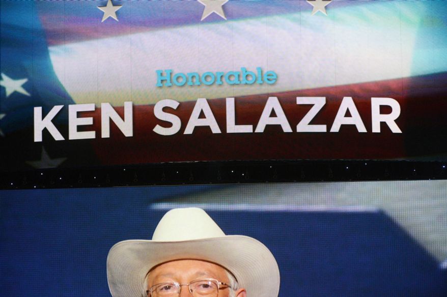 Ken Salazar, Secretary of the Interior, is seen on the large screen above the stage. (Andrew Geraci/ The Washington Times)