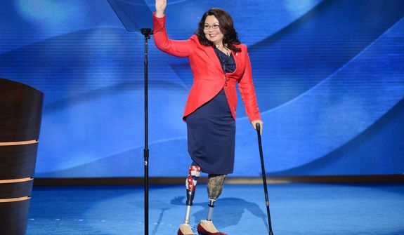 Lt. Col. Tammy Duckworth, candidate for the US House of Representatives for Illinois and former Assistant Secretary of the US Department of Veterans Affairs leaves the stage after addressing the Democratic National Convention. (Andrew Geraci/ The Washington Times)