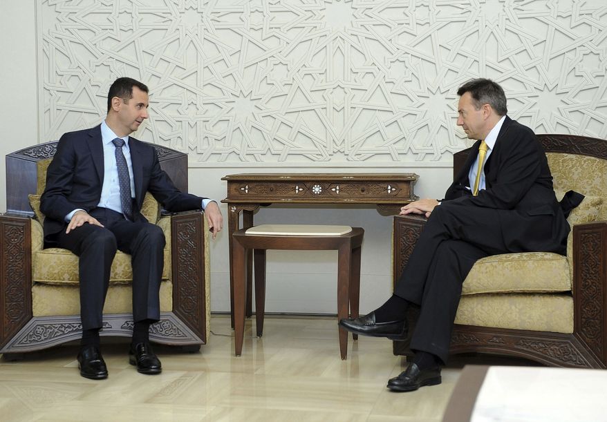 Syrian President Bashar Assad (left) meets with Peter Maurer, president of the International Committee of the Red Cross, in Damascus, Syria, on Tuesday, Sept. 4, 2012. Mr. Assad told Mr. Maurer that the Red Cross is welcome to operate on the ground in the country as long as it remains "neutral and independent," the SANA state news agency reported. (AP Photo/SANA)