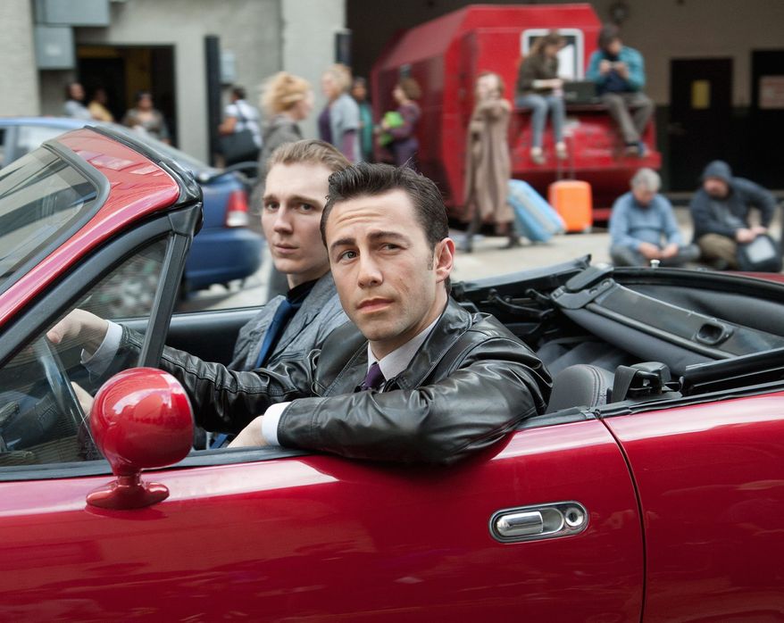 Joseph Gordon-Levitt (front) and Paul Dano co-star in a scene from the thriller "Looper." In its 37th year, the Toronto International Film Festival opens Thursday with the big Hollywood action film, a sci-fi tale also starring Bruce Willis and Emily Blunt. (Sony Pictures Entertainment)