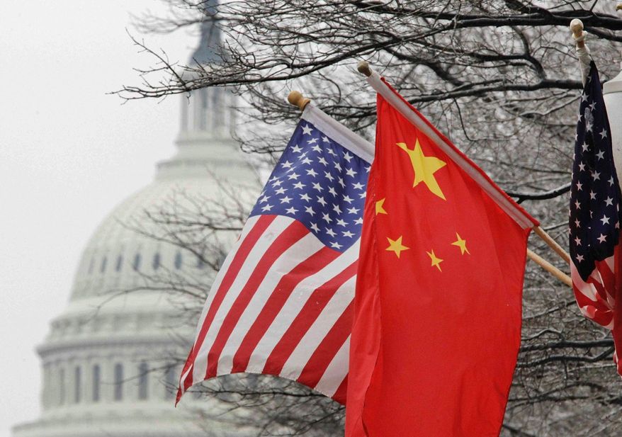 Chinese flags flew in Washington when President Hu Jintao visited in 2011, despite the ongoing rift between the two governments on China’s monetary policies, rifts that persist today despite actions by China to realign its currency. (Associated Press)