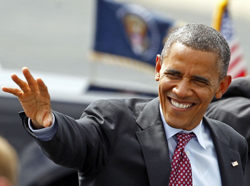 President Obama waves to supporters Sept. 5, 2012, as he arrives at the Charlotte/Douglas International Airport in Charlotte, N.C., for the Democratic National Convention. (Associated Press)