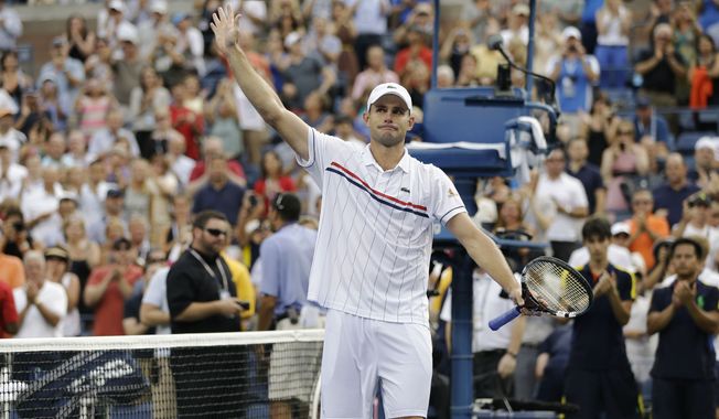 Andy Roddick waves to fans after his loss to Argentina&#x27;s Juan Martin Del Potro in the quarterfinals during the 2012 US Open tennis tournament,  Wednesday, Sept. 5, 2012, in New York. Roddick said he would retire after the match. (AP Photo/Darron Cummings)