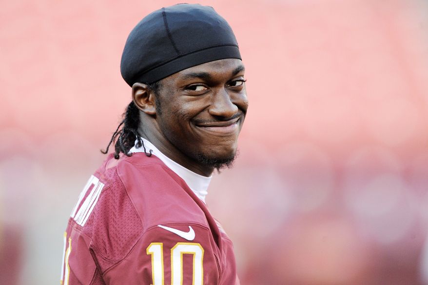 Washington Redskins quarterback Robert Griffin III (10) smiles during warmups at FedEx Field, Landover, Md., Aug. 29, 2012. (Preston Keres/Special to The Washington Times)