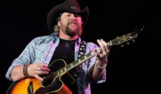 ** FILE ** Singer Toby Keith has been entertaining members of the military for 10 years with USO shows. “I love our nation’s troops, and I won’t ever stop doing my part to extend my thanks,” he says. (Associated Press)