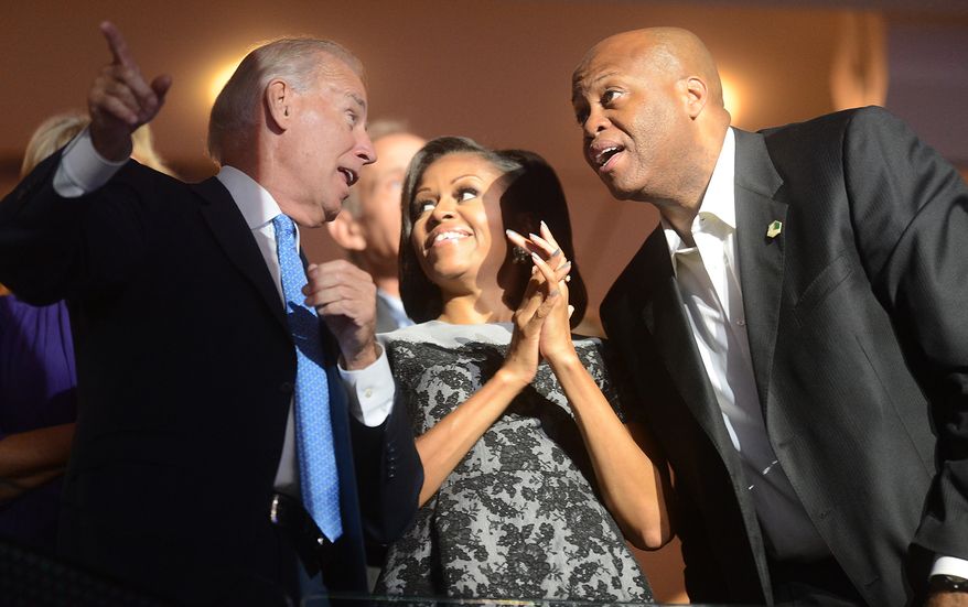 Vice-President Joe Biden talks with First Lady Michelle Obama and her brother Craig Robinson at the Democratic National Convention at the Time Warner Arena in Charlotte, N.C., on Wednesday, September 5, 2012. (Barbara Salisbury/ The Washington Times)