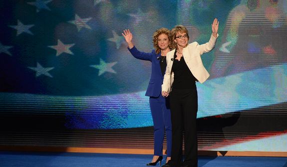 Rep. Debbie Wasserman Schultz, D- Fla., joins former Arizona Congresswoman Gabrielle Giffords in saying the Pledge of Allegiance on the night that President Barack Obama accepts his party&#39;s nomination for a second term as President of the United States at the Democratic National Convention in the Time Warner Cable Arena in Charlotte, N.C., on Thursday, September 6, 2012.(Andrew Geraci/ The Washington Times)