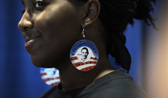 Shawanna Black of Charlotte, N.C., wears earrings made by her sister who also volunteered four years ago, on the night that President Barack Obama accepts his party&#39;s nomination for a second term as President of the United States at the Democratic National Convention in the Time Warner Arena in Charlotte, N.C., on Thursday, September 6, 2012. (Barbara Salisbury/ The Washington Times)
