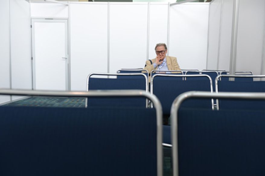 A man who refused to give his name to The Washington Times prays in a designated Prayer Room in the Charlotte Convention Center during the Democratic National Convention in Charlotte, N.C., on Thursday, September 6, 2012. (Barbara Salisbury/ The Washington Times)