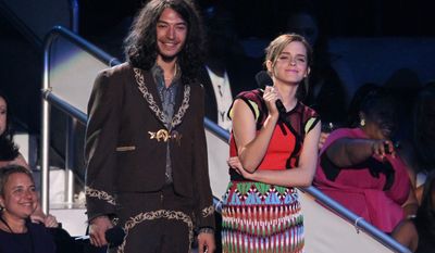 Ezra Miller, left, and Emma Watson speak onstage at the MTV Video Music Awards on Thursday, Sept. 6, 2012, in Los Angeles. (Photo by Matt Sayles/Invision/AP)