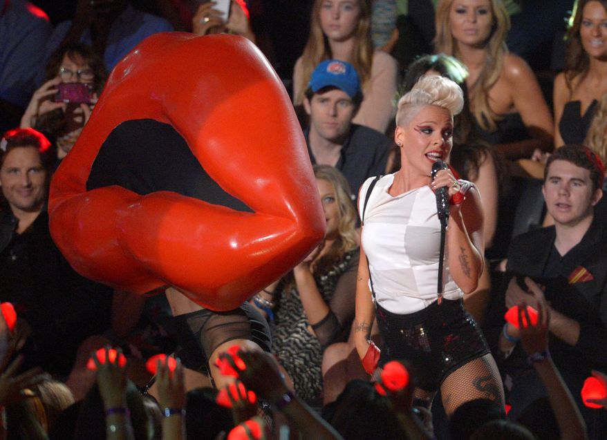 ** FILE ** Pink performs in the audience at the MTV Video Music Awards on Thursday, Sept. 6, 2012, in Los Angeles. (Mark J. Terrill/Invision/AP)