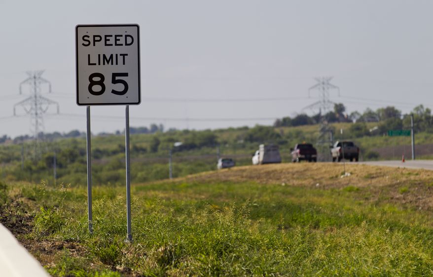 An 85 mph speed limit sign is placed Sept. 6, 2012, on a 41-mile toll road in Austin, Texas, near the increasingly crowded Interstate between Austin and San Antonio. (Associated Press/Statesman.com, Ricardo B. Brazziell)