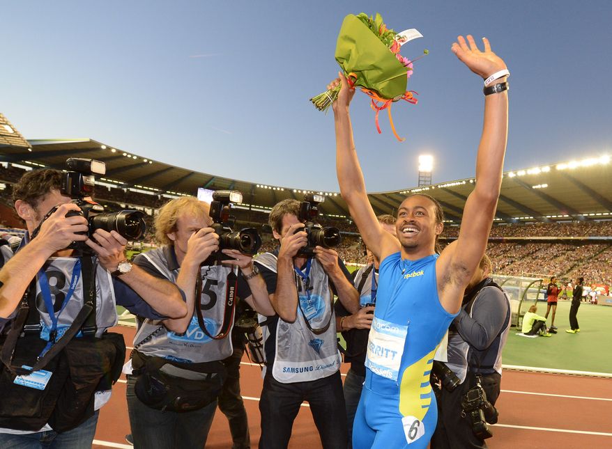 US athlete Aries Merritt reacts after winning the 110 meters hurdles and breaking a new world record, at the Diamond League Memorial Van Damme athletics event at Brussels' King Baudouin Stadium, Friday, Sept. 7, 2012. (AP Photo/Geert Vanden Wijngaert)