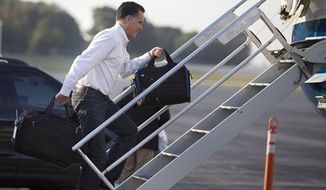 Republican presidential candidate, former Massachusetts Gov. Mitt Romney boards his campaign plane for an event in Iowa on Friday, Sept. 7, 2012, in Portsmouth, N.H. (AP Photo/Evan Vucci)