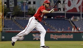Washington Nationals&#39; Jayson Werth tosses his bat after the hit for his solo home run to tie the game during the ninth inning of a baseball game against the Miami Marlins at Nationals Park Saturday, Sept. 8, 2012, in Washington. The Nationals won 7-6 in 10 innings. (AP Photo/Alex Brandon)