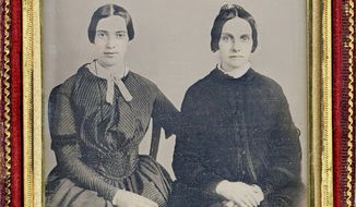 Researchers are trying to prove that this daguerreotype shows a 30-year-old Emily Dickinson (left) with her friend Kate Scott Turner. It would be only the second known photo of the poet. (Associated Press)