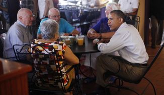 President Obama (right) sits with patrons (from left to right) John and Shirley Hill and Gerry and Jan Clark during his visit to Ossorio Bakery and Cafe in Cocoa, Fla., on Sunday, Sept. 9, 2012. (AP Photo/Pablo Martinez Monsivais)