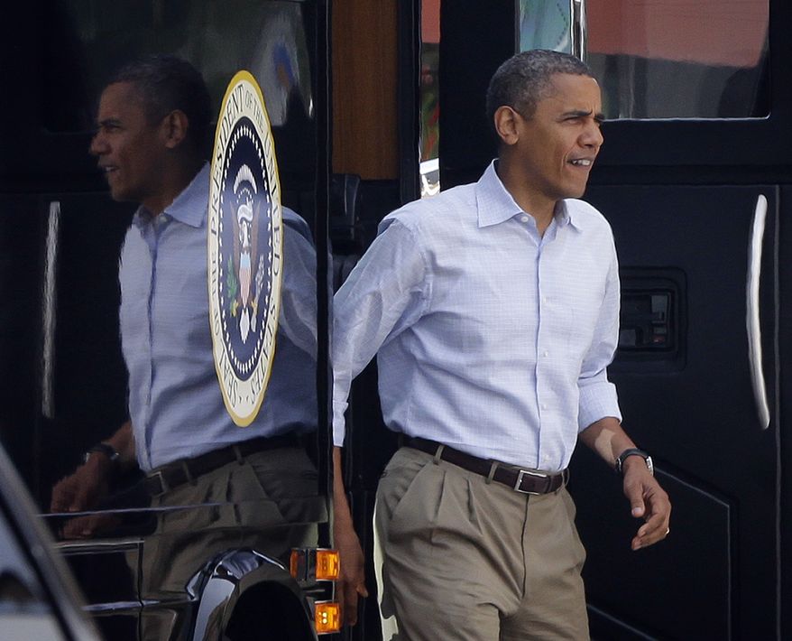 President Obama steps off his campaign bus during an unannounced stop at Ossorio Bakery and Cafe in Cocoa, Fla., on Sunday, Sept. 9, 2012. (AP Photo/Pablo Martinez Monsivais)