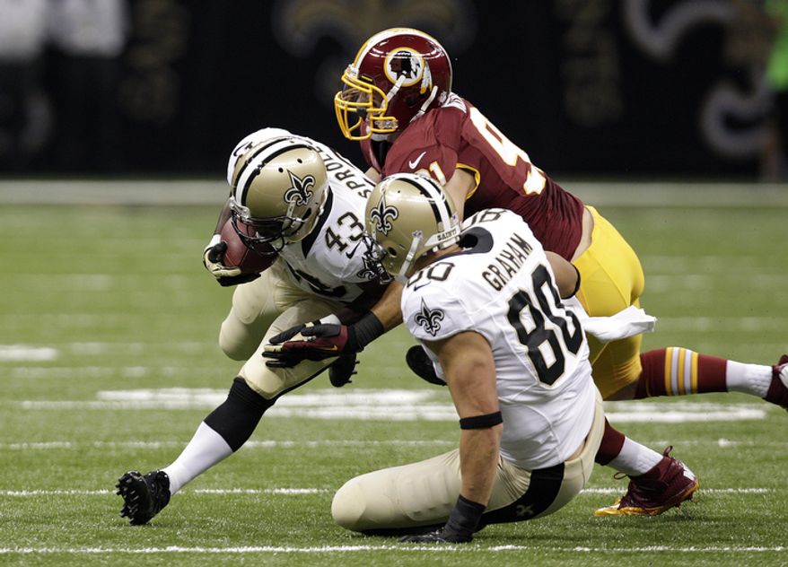New Orleans Saints running back Darren Sproles (43) rushes in the first half of an NFL football game at the Mercedes-Benz Superdome in New Orleans, Sunday, Sept. 9, 2012. (AP Photo/Matthew Hinton)