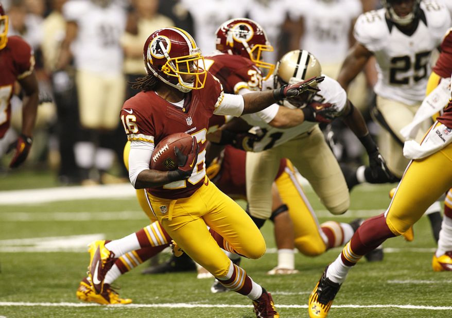 Washington Redskins wide receiver Brandon Banks (16) carries in the first half of an NFL football game at the Mercedes-Benz Superdome in New Orleans, Sunday, Sept. 9, 2012. (AP Photo/Bill Haber)