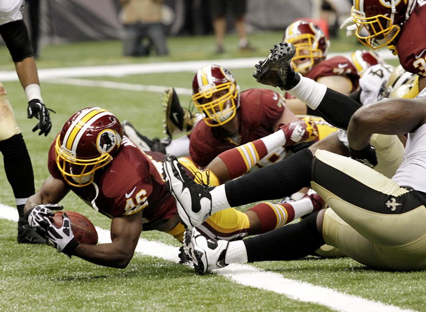 Washington Redskins running back Alfred Morris (46) scores a touchdown in the second half of an NFL football game against the New Orleans Saints at the Mercedes-Benz Superdome in New Orleans, Sunday, Sept. 9, 2012. (AP Photo/Matthew Hinton)