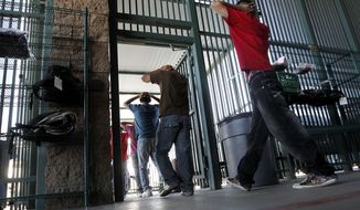 **FILE** Illegal immigrants prepare to enter a bus after being processed at the U.S. Border Patrol&#x27;s Tucson Sector headquarters on Aug. 9, 2012, in Tucson, Ariz. (Associated Press)