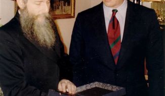 This Dec. 1993 photo provided by the Chabad-Lubavitch collection shows Vice President Al Gore presenting a book from the Schneerson Collection to Rabbi Boruch Shlomo Cunin of Chabad of California, in Moscow. The Obama administration is opposing a Jewish group’s bid to levy civil fines against Russia for failing to obey a court order to return its historic books and documents _ a dispute which has halted the loan of Russian art works for exhibit in the United States. (AP Photo/Chabad-Lubavitch collection)