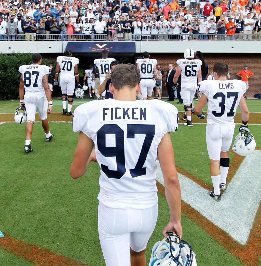 Penn State kicker Sam Ficken (97) walks off the field after missing a field goal in the final seconds of the team’s 17-16 loss to Virginia on Saturday, Sept. 8, 2012, during an NCAA college football game in Charlottesville, Va. (AP Photo/Andrew Shurtleff)