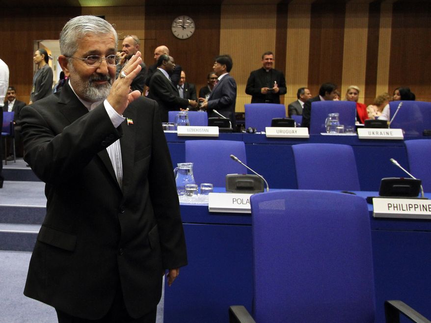 ** FILE ** Ali Asghar Soltanieh, Iran&#x27;s ambassador to the International Atomic Energy Agency (IAEA), waves on Sept. 10, 2012, as he arrives for a meeting of the IAEA board of governors at the International Center in Vienna, Austria. (Associated Press)