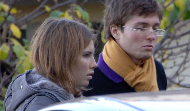 ** FILE ** Amanda Knox and then-boyfriend Raffaele Sollecito are pictured in November 2007 outside the rented house in Perugia, Italy, where 21-year-old British student Meredith Kercher was found dead. (AP Photo/Stefano Medici)