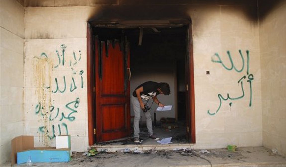 A man looks at documents at the U.S. consulate in Benghazi, Libya, after an attack that killed four Americans, including Ambassador Chris Stevens, Wednesday, Sept. 12, 2012. The graffiti reads, &quot;no God but God,&quot; &quot;God is great,&quot; and &quot;Muhammad is the Prophet.&quot; The American ambassador to Libya and three other Americans were killed when a mob of protesters and gunmen overwhelmed the U.S. Consulate in Benghazi, setting fire to it in outrage over a film that ridicules Islam&#x27;s Prophet Muhammad. (AP Photo/Ibrahim Alaguri)

