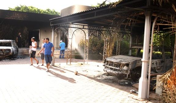 ** FILE ** Libyans walk on the grounds of the gutted U.S. Consulate in Benghazi, Libya, after an attack that killed four Americans, including U.S. Ambassador J. Christopher Stevens, on Wednesday, Sept. 12, 2012. (AP Photo/Ibrahim Alaguri)

