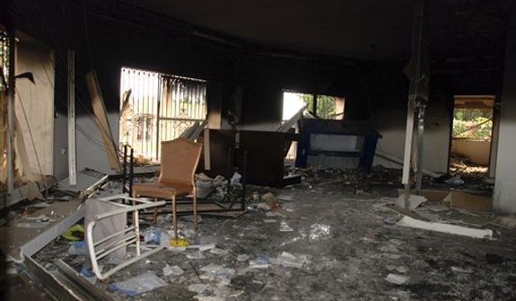 Glass, debris and overturned furniture are strewn inside a room in the gutted U.S. Consulate in Benghazi, Libya, on Wednesday, Sept. 12, 2012, after an attack the previous day killed four Americans, including Ambassador J. Christopher Stevens. (AP Photo/Ibrahim Alaguri)

