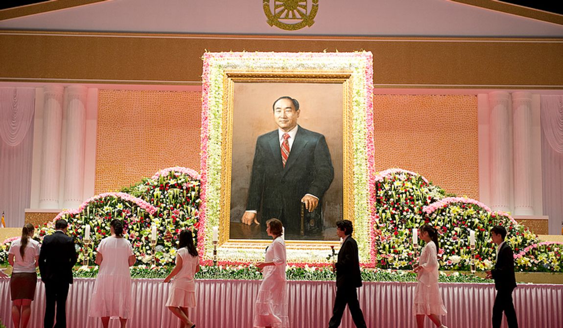 Mourners file past a portrait of the late Rev. Sun Myung Moon as they prepare to offer flowers in tribute to him at the Cheongpyeong Heaven and Earth Training Center complex near Seoul, Korea on Wednesday, Sept. 12, 2012. The 13-day memorial will culminate Saturday with a funeral service. Officials are expecting to completely fill the 30,000-person stadium. (Barbara L. Salisbury/The Washington Times)
