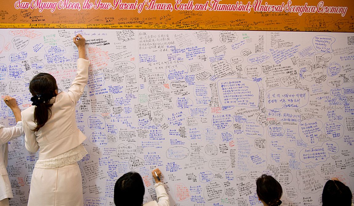 Mourners write messages for the family of the Rev. Sun Myung Moon inside the Cheongpyeong Heaven and Earth Training Center complex near Seoul, Korea on Wednesday, Sept. 12, 2012. These message walls are filled and must be replaced every day, according to officials. They will later be moved to the museum, which is inside the palace building on the complex. The church currently has members in 194 countries around the world. (Barbara L. Salisbury/The Washington Times)
