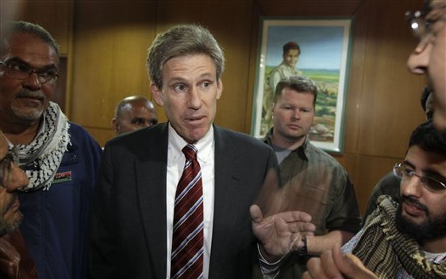 **FILE** U.S. envoy Chris Stevens speaks April 11, 2011, to local media at the Tibesty Hotel where an African Union delegation was meeting with opposition leaders in Benghazi, Libya. The U.S. ambassador and three other Americans were killed in an attack on the U.S. consulate in Benghazi by protesters angry over a film that ridiculed Islam's Prophet Muhammad. (Associated Press)