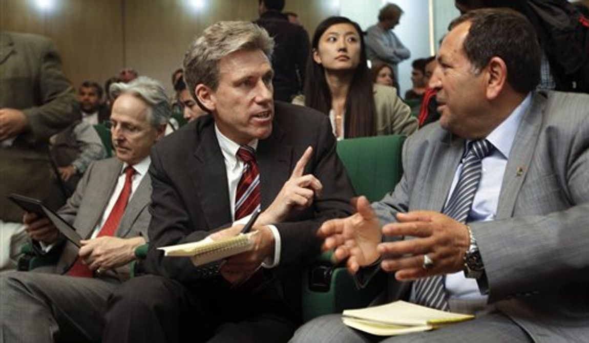 **FILE** U.S. envoy Chris Stevens (center), accompanied by British envoy Christopher Prentice (left), speaks April 11, 2011, to Council member for Misrata Dr. Suleiman Fortia (right) at the Tibesty Hotel where an African Union delegation was meeting with opposition leaders in Benghazi, Libya. (Associated Press)