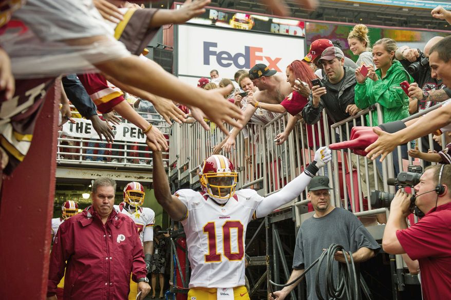andrew harnik/the Washington Times
Redskins quarterback Robert Griffin III threw for 320 yards and two touchdowns at New Orleans in his NFL debut, and he hasn’t even scratched the surface.