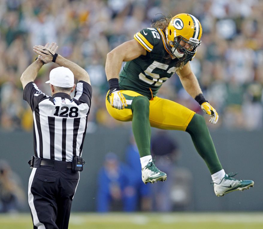 Green Bay Packers' Clay Matthews (52) reacts after sacking San Francisco 49ers' Alex Smith during the second half of an NFL football game Sunday, Sept. 9, 2012, in Green Bay, Wis. The 49ers won 30-22. (AP Photo/Mike Roemer)